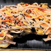 Delicato Roll · Deep-fried roll. Inside: Shrimp tempura, cream cheese, avocado, crab meat
Top: Spicy shredde...