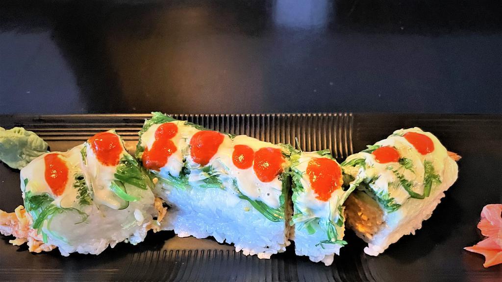 Blue Hawaiian Roll · Inside: Shrimp tempura, spicy crab, avocado, cucumber. Top: seaweed salad and wasabi mayo and hot sauce.