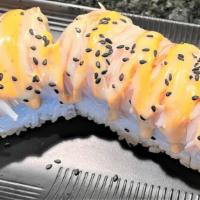 Red Kang Kang Roll · Inside: Shrimp tempura, pineapple, cucumber, cooked tuna. Top: Fish cake and sesame seeds (c...
