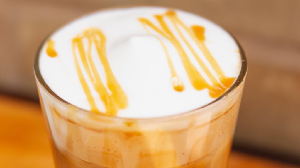 Iced Caramel Macchiato · A layered Latte where the Espresso is poured over iced milk and Caramel is drizzled on top.