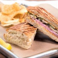 Cubano · Roasted pork, black forest ham, Swiss cheese, dill pickle chips, and chipotle mayo.