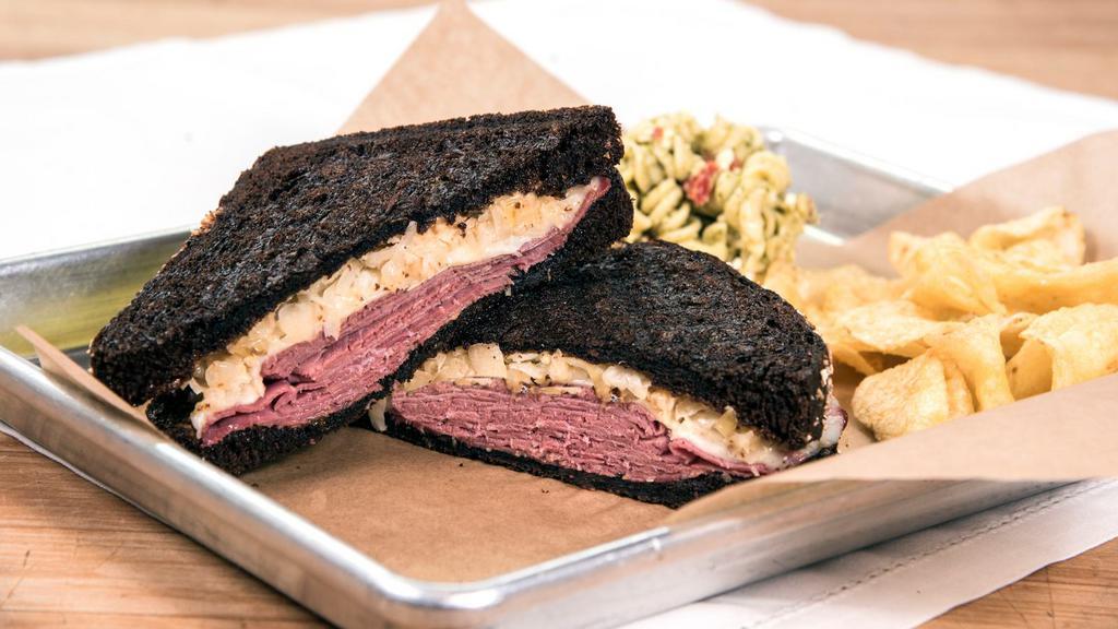 Classic Reuben · Corned beef, Swiss, sauerkraut and one,000 island dressing, served on our thick cut black pumpernickel.