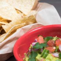 Chips + Fresh Guacamole · Authentic zesty guacamole with a side of fire roasted salsa.