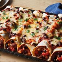 Enchiladas · Gluten free. Corn tortillas served with a mixture of cheddar + pepper jack cheese with red o...