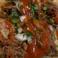 Carnitas Taco · Served with onions, cilantro and salsa.