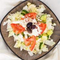 Greek Salad · Fresh mixed greens with spinach, kale, cucumbers, tomatoes, carrots, cabbage, kalamata olive...