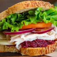 Roasted Turkey Call · Oven roasted turkey, provolone cheese with our cranberry horseradish sauce, lettuce, tomato ...