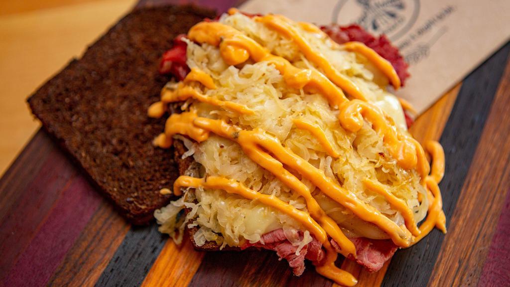 Rueben · Perfectly balanced with corned beef, melted swiss cheese, long-grain sauerkraut and thousand island dressing - Served on Pumpernickel Rye bread.