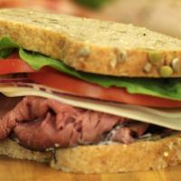 Roast Beef & Provolone · Sliced roast beef, aged provolone cheese, lettuce, tomato and red onion - served on Honey Wh...