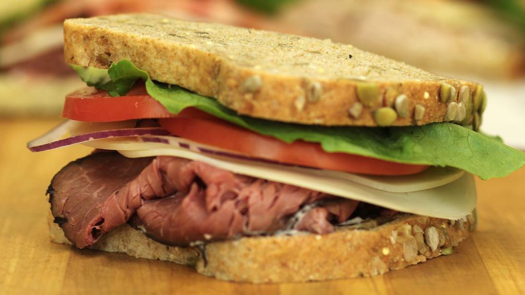 Roast Beef & Provolone · Sliced roast beef, aged provolone cheese, lettuce, tomato and red onion - served on Honey Whole Wheat bread.