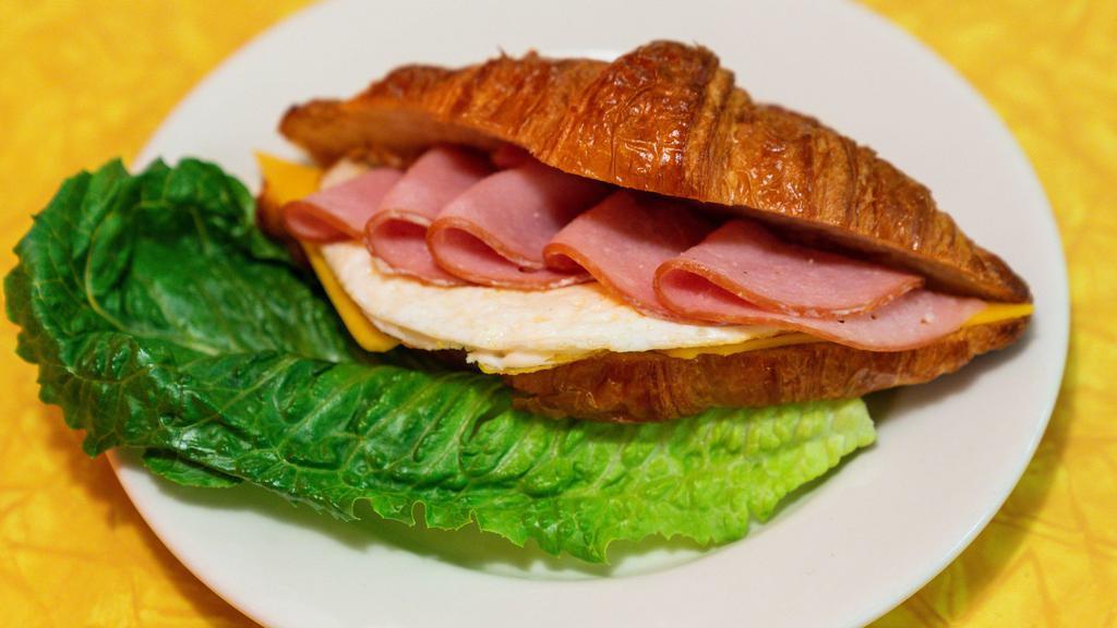 Croissant · Egg and cheese with choice of ham, bacon, or sausage.