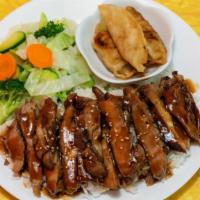 Chicken Teriyaki With Steamed Veggie · Grilled chicken over rice and comes with steamed vegetables and pot stickers.