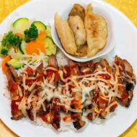 Spicy Chicken With Mozzarella Cheese · Grilled spicy chicken with mozzarella cheese  over rice and comes with steamed vegetables an...