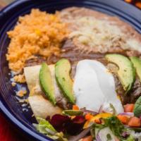 Enchiladas Suizas (2) · Gluten-free. Shredded chicken and sour cream smothered with mole poblano, cheese and avocado...