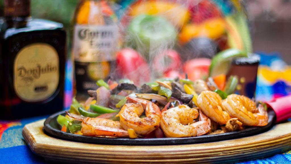 Shrimp Fajitas · Gluten-free. Ten large grilled seasoned shrimp with tomatoes, onions and bell peppers.