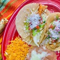 Fish Tacos · Gluten-free. Grilled mahi-mahi topped with cabbage avocado sauce, pico de gallo and queso fr...