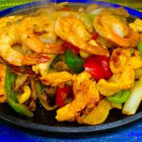 Classic Seafood Fajitas · Gluten-free. Grilled shrimp, calamari steak, mahi-mahi, mussels, clams and grilled vegetables.