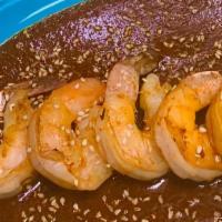 Camarones A La Iguana · Spicy, house specialties, gluten-free. Ten large shrimp sautéed then simmered in a spicy red...