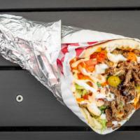 Beef Gyro · Shredded beef, tahini sauce, onion, lettuce, parsley, tomato and pickles double.