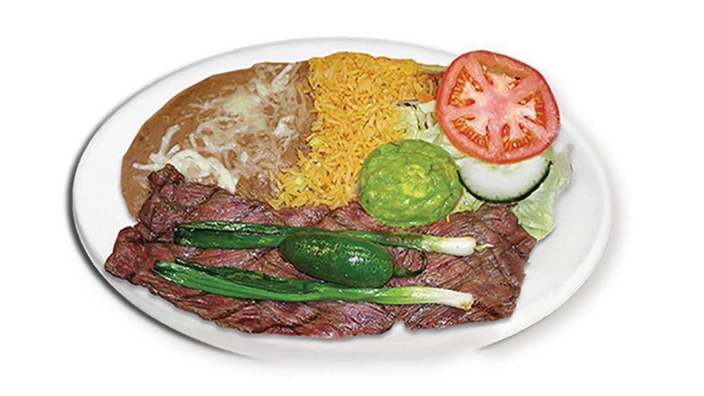 Carne Asada · Skirt steak seasoned and grilled to perfection! Served with rice, beans, Pico de Gallo, Guacamole, a fried pepper and green onion, and homemade tortillas.