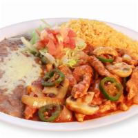 Pollo A La Diabla · Spicy! Chicken breast strips sautéed in butter and cooked in a spicy sauce with mushrooms, j...