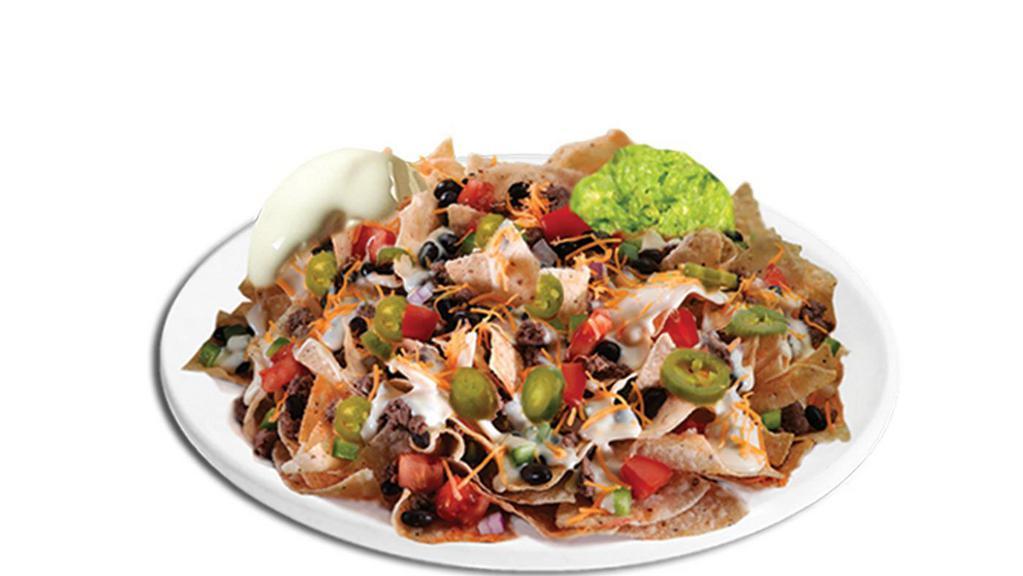 Nachos · Choice of meat. Topped with black beans, sour cream, guacamole and jalapeño.