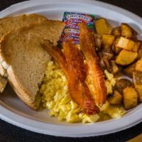 Traditional Breakfast · Two scrambled eggs, home fries, toast and choice of bacon, ham, sausage or turkey.