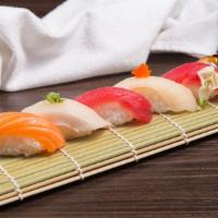 Sushi Sampler · Five pieces of chef's choice nigiri.

Consuming raw or uncooked meat, seafood, or shellfish ...