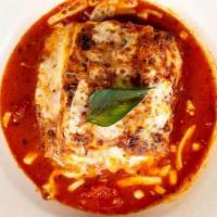 Beef Lasagna · Flat sheet pasta layered with slow cooked meat sauce, creamy bechamel, parmigiano and whole ...
