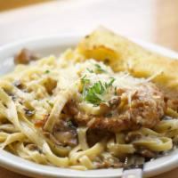 Chicken Marsala · Two lightly breaded chicken breasts sautéed and served with a creamy Marsala wine and mushro...