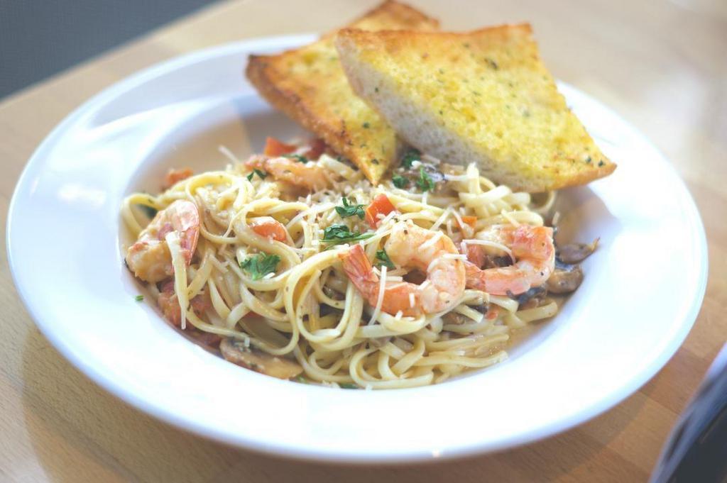 Prawn Linguine · Fresh linguini with sautéed prawns, mushrooms and diced tomatoes tossed with a creamy lemon sauce