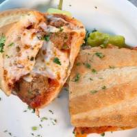 Meatball Parmesan · Homemade beef meatballs, marinara sauce, mozzarella and parmesan cheese on top of French bread