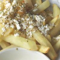 Greek Fries · Fries seasoned with Greek Oregano and feta cheese and served with special sauce