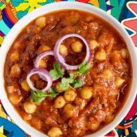 Chickpea Masala · Whole chickpeas, slow-cooked in an onion and tomato curry with Indian whole spices.