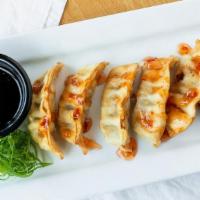 Sizzlin' Hot Pot Stickers · Golden fried pork and vegetable gyozas served with ponzu sauce.