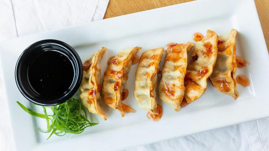 Sizzlin' Hot Pot Stickers · Golden fried pork and vegetable gyozas served with ponzu sauce.