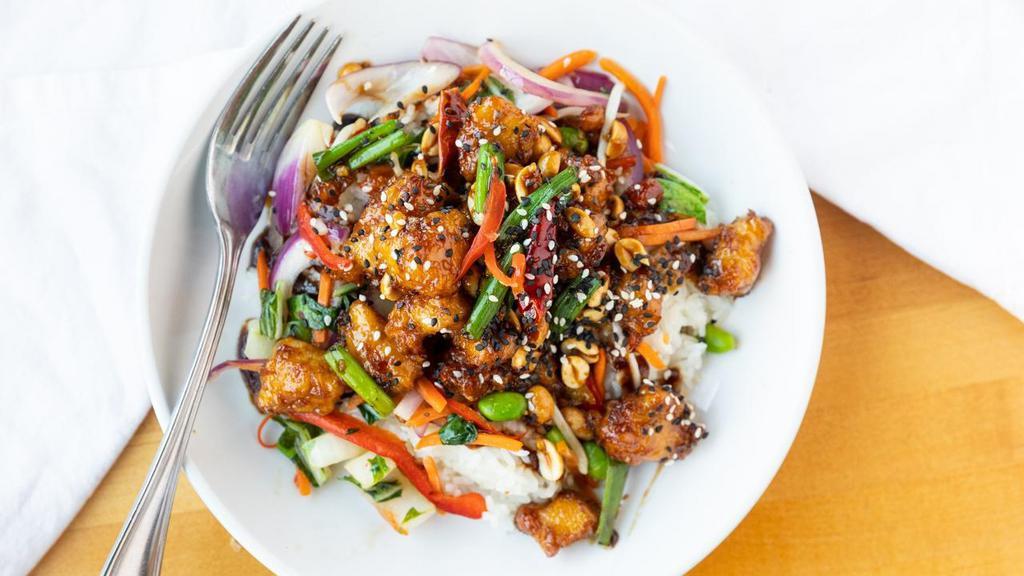 Kung Pow! Chicken Joy Bowl · Pan seared chicken tossed in a traditional spicy Kung Pao sauce with chiles, garlic, ginger and peanuts. Served with Ginger Soy Glaze and Sweet Thai Chili Vegetable Mix and bean sprouts. Garnished with red pepper curls.