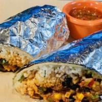 Spicy Chicken Burrito · Grilled jumbo flour tortilla filled with spicy chicken, jack cheese, cilantro rice, choice o...
