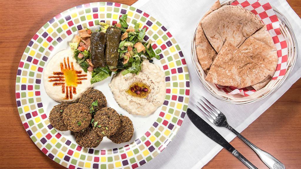 Vegetarian Platter (Veg) · Five pieces falafel and two pieces dolmas. Served with hummus, baba ghanaous, fattoush salad, pita bread or tortilla.