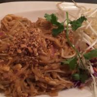 Pad Thai · Medium sized rice noodles with egg, onions, and bean sprouts. Topped with ground peanuts. Co...