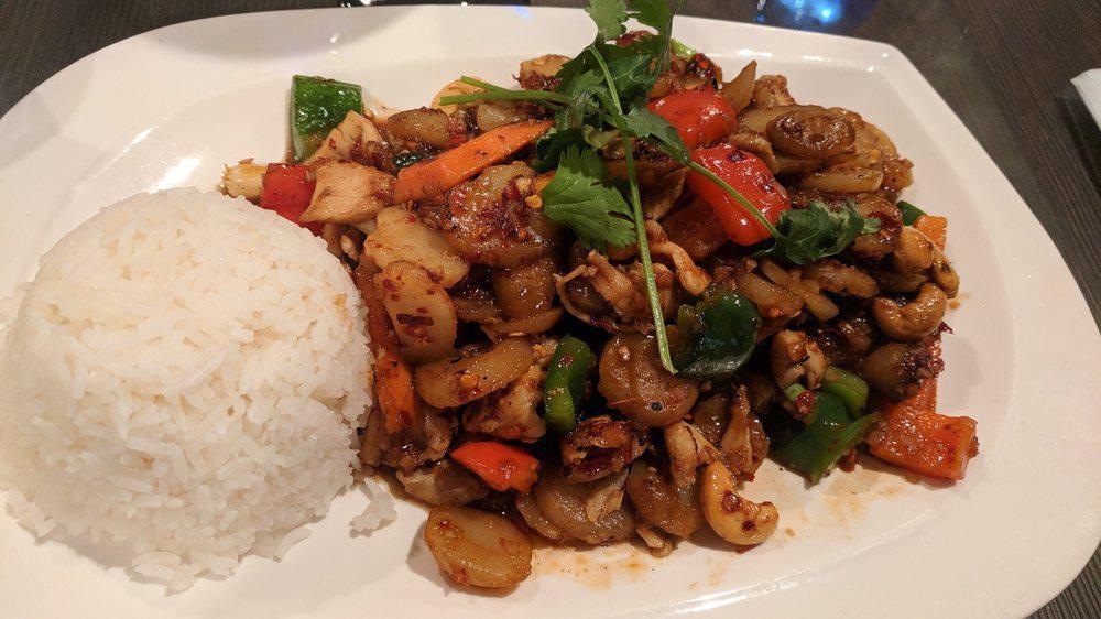 Spicy Chicken With Cashew Nuts · Spicy. Chicken stir-fried with onion, water chestnuts, bell peppers, carrots and cashews. Comes with side of rice. Choice of spice level.