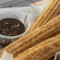Churros & Chocolate · Fried pastry dusted with cinnamon sugar.