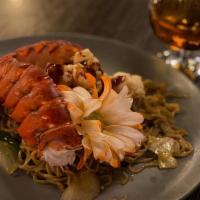 Pad Sen Lobster · Stir-fried soba noodles in garlic sauce topped with crispy lobster.