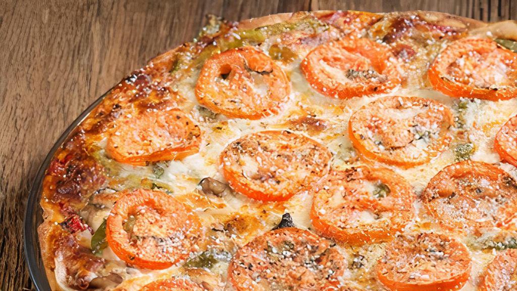 The Veggie Pizza · This Great tasting Pizza Includes Mushroom, Onion, Green Pepper w/ Sliced Tomato on Top!
