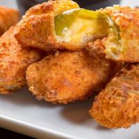 Jalapeño Poppers · Cream or cheddar cheese served with ranch dipping sauce.
