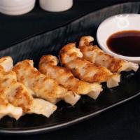 Gyoza (6) · Steamed and panfried pork and chicken potstickers.