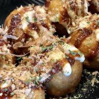 Takoyaki (8) · Fried balls of octopus in savory Japanese pancake batter.