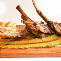 Australian Lamb Chops · Four grilled bone-in chops, four cheeses scalloped potatoes and seasonal vegetables with pis...