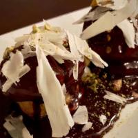 Profiterole · House-made daily choux or eclair balls, house-made vanilla pastry cream, and house-made choc...