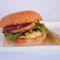 Classic Roost Burger · All natural premium 6oz chicken breast on a brioche bun topped with tomato, red onion, lettu...